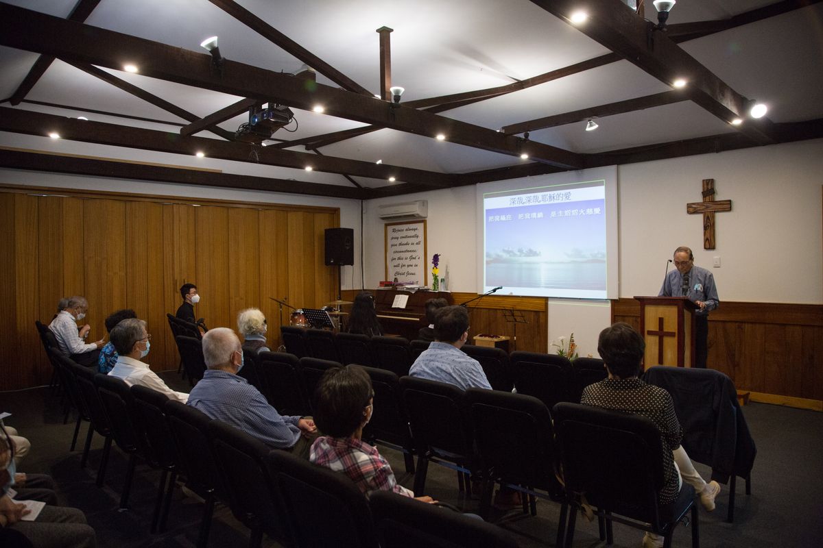 Sunday church service with worship band and congregation